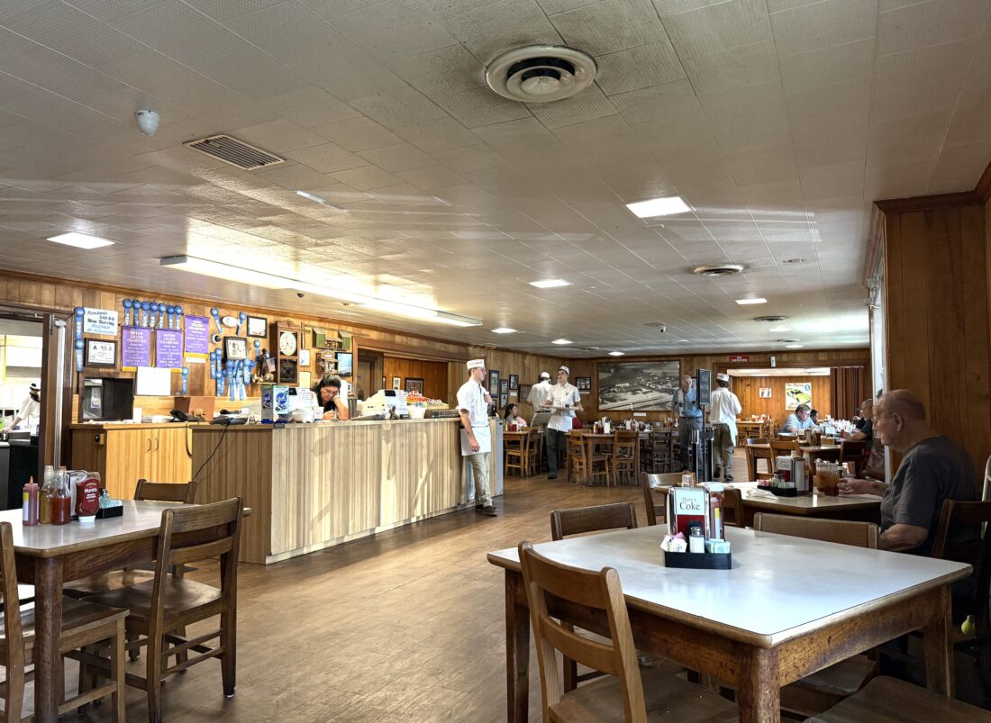 Inside a wood paneled BBQ joint